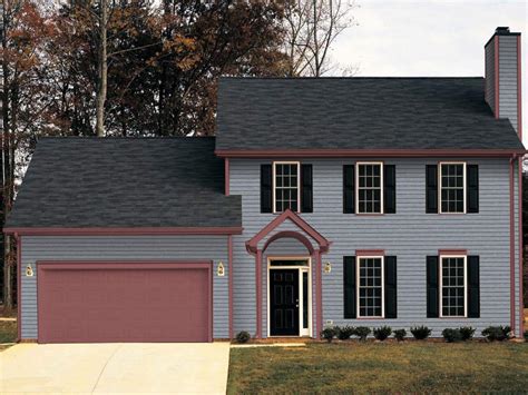 gray house with red metal roof|gray exterior with black trim.